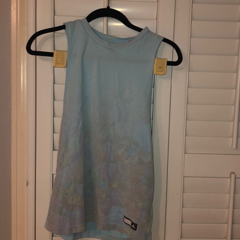 Light blue athletic tank top with floral pattern.